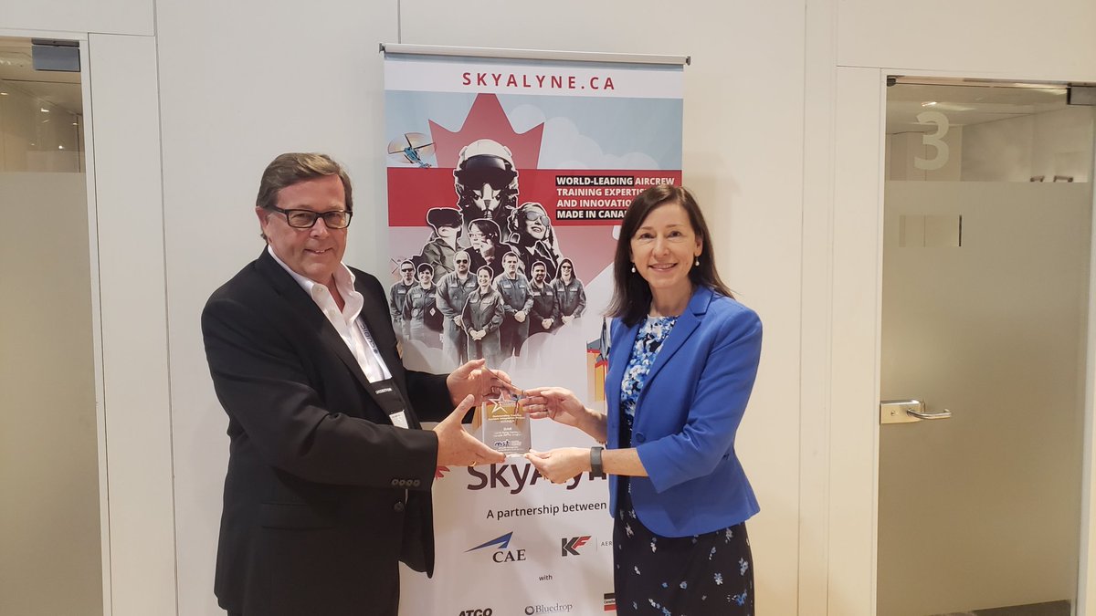 CAE_Defence's tweet photo. A year delayed due to pandemic, but CAE's France Hebert receives 2020 Outstanding Training Systems Integration award for the NATO Flying Training in Canada #NFTC program from @MST_Magazine @halldalegroup  during @iitsec #IITSEC https://t.co/nd9Ki4XOIY