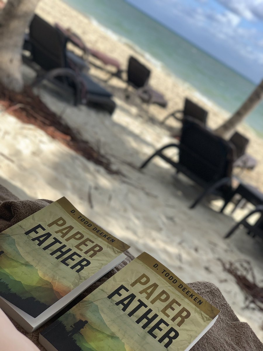 ToddDeeken's tweet photo. A couple on a Cancun vacation sent me this. I’m flattered they are spending their time away reading this - probably better to read this world while a long way away from anything like it. https://t.co/ISvkT9fhOT