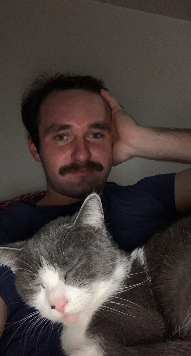 Excuse the lighting but a man and his cat on a chilly Tuesday