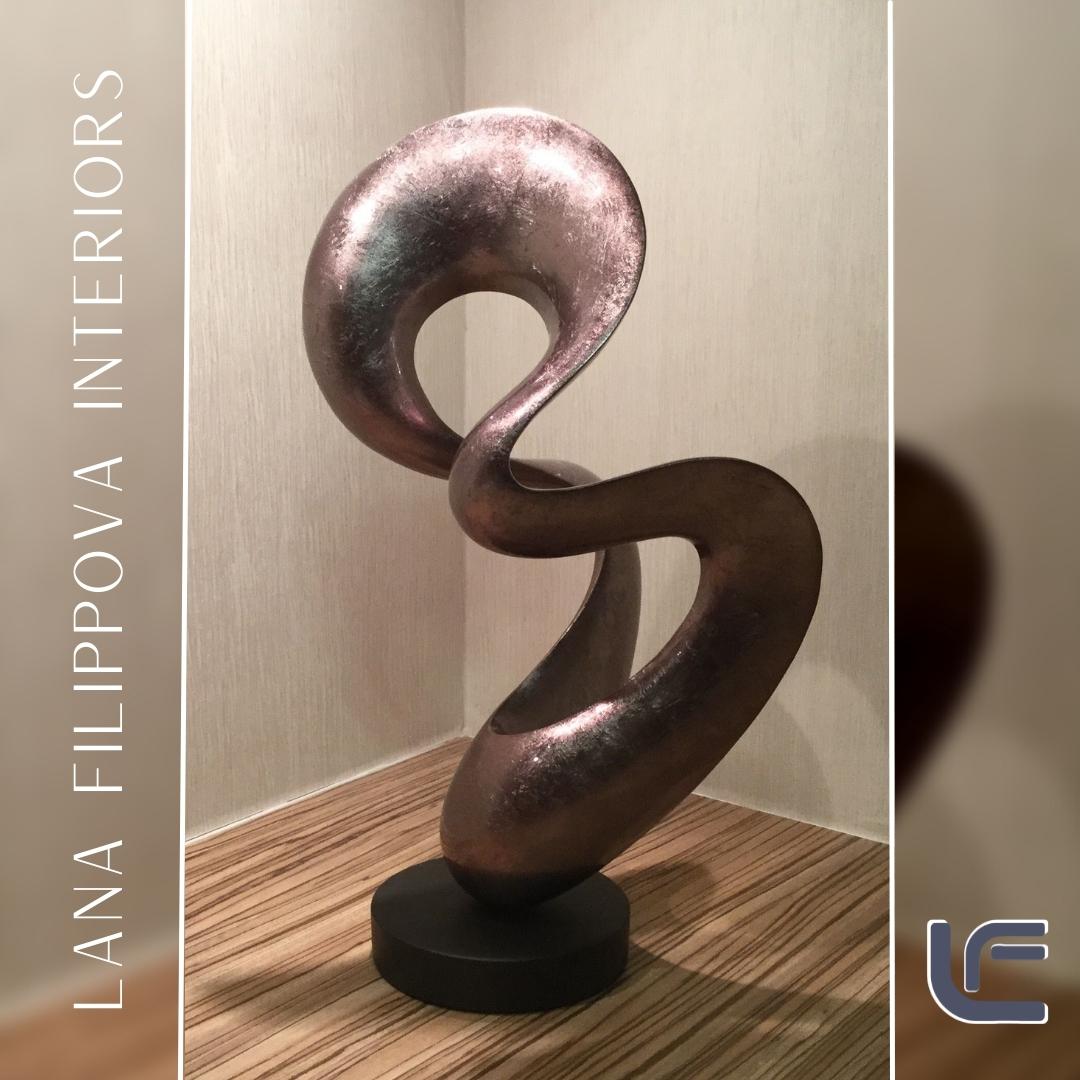 Adding a striking piece of sculpture to your living space creates a striking focal point in any room