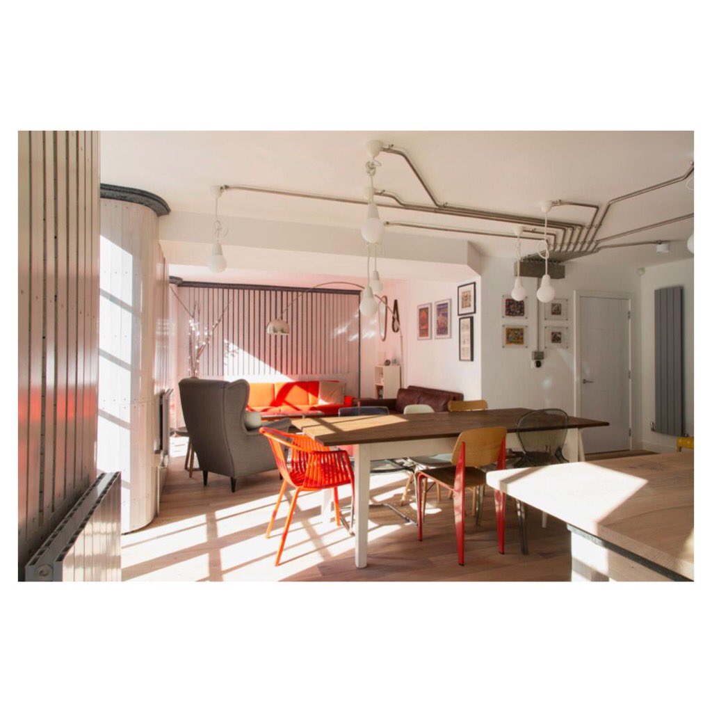 Three sets of glazed doors connect the living spaces with the garden in our Reuse Flat project. Each set generously illuminates the kitchen, dining and lounge areas. #insulate #reuse #recycle