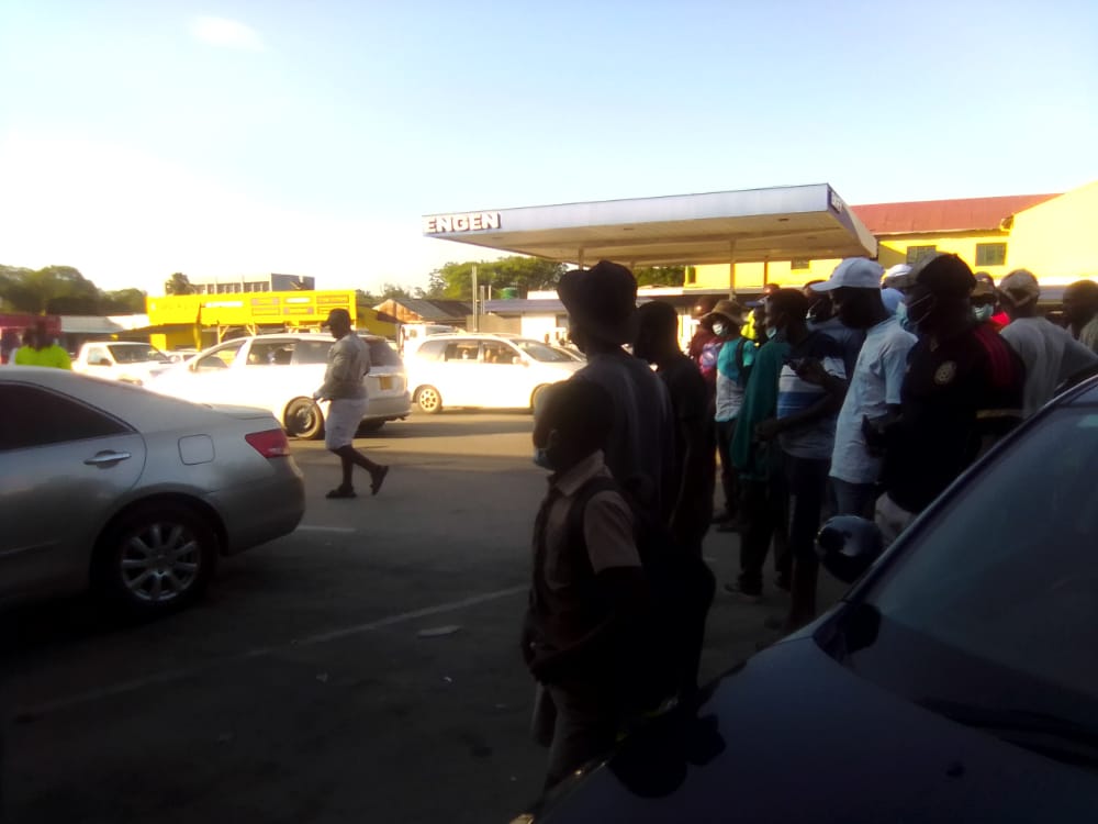 TellZimbabwe's tweet photo. Drama at OK supermarket in Masvingo CBD as scores of people jostle to catch a glimpse of a snake (black mamba) that was allegedly seen in a man's car parked outside the retail outlet this late afternoon. https://t.co/cRms3EdG4a