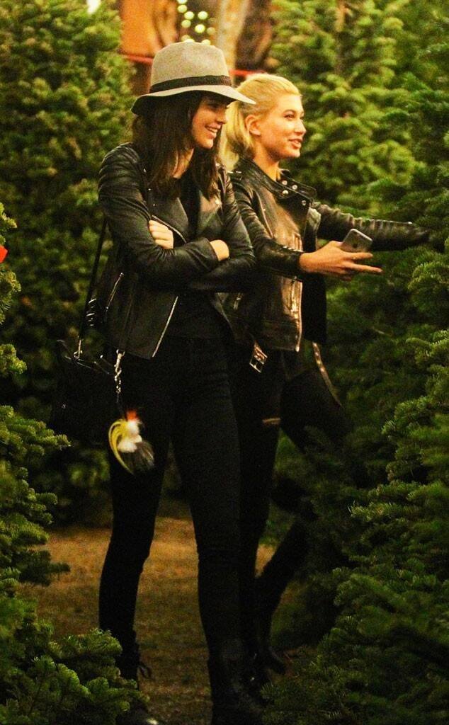 fetusbaldwin's tweet photo. its december! and here's hailey baldwin hugging a christmas tree https://t.co/lnNa6guwir