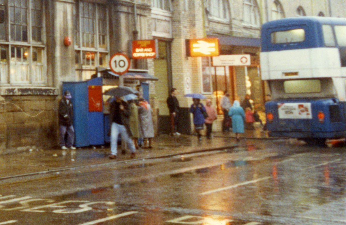 angus_young61's tweet photo. The blue kiosk, the British Rail sign, the blue and white bus, the rain. Hull memories. https://t.co/eAFQv86By8