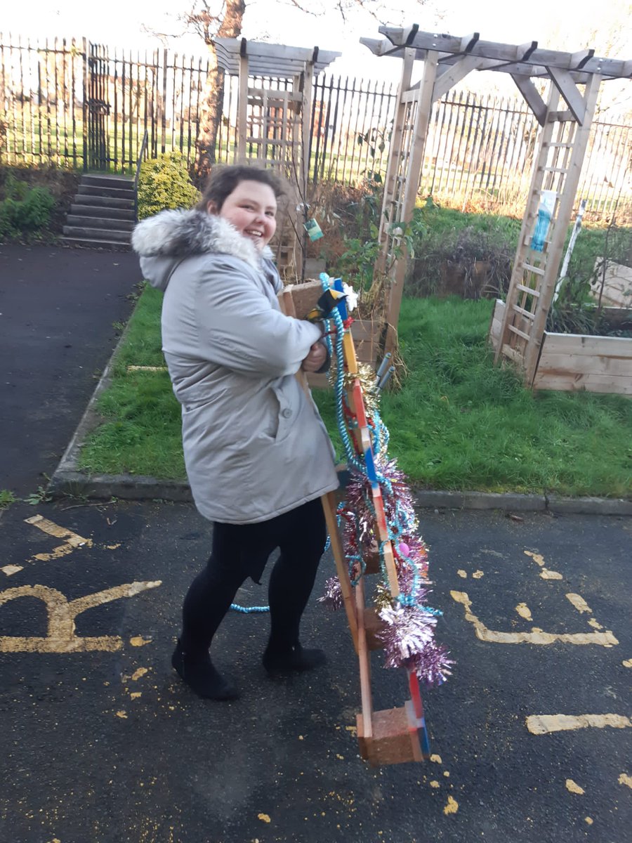 CedarbankSchool's tweet photo. 3C took some of the pallet Christmas trees that were made yesterday to the front of the school. They look heavy! Some staff were excited to take them home. #bamconstruction @LoveWestLothian https://t.co/V9Wk7OsORs