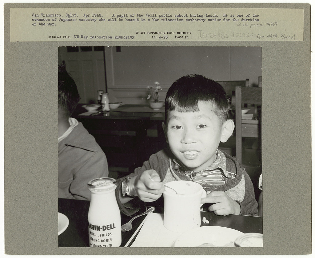 San Francisco, Calif. Apr. 1942. A pupil of the Weill public school having lunch. He is one of the evacuees of Japanese ancestry who will be housed in a War Relocation Authority center for the duration of the war (LOC) Lange, Dorothea,, photographer.