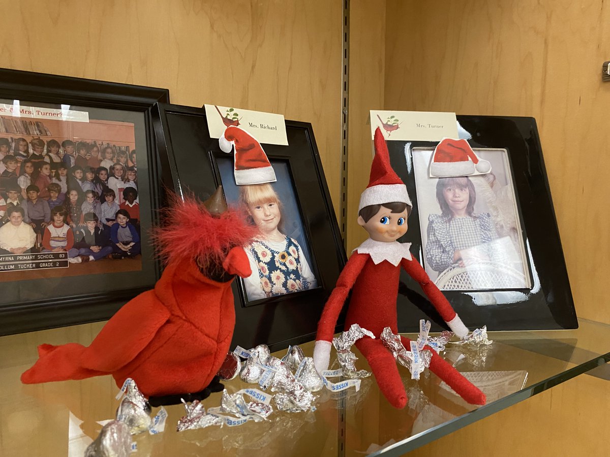 SCECardinals's tweet photo. That silly Creek the Elf! He put hats on the pictures of Mrs. Turner and Mrs. Richard when they were kids in our trophy case! @TinaTurnerSCE @AmberRichardSCE @elfontheshelf #thatsillyelf #creeklife #creeklifeisthebestlife https://t.co/tfvnZeUBcW