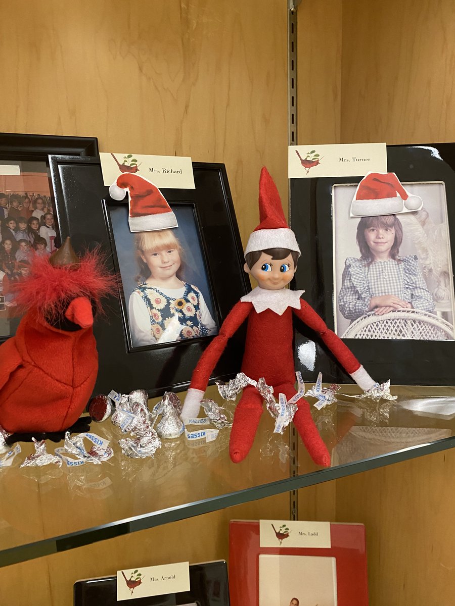 SCECardinals's tweet photo. That silly Creek the Elf! He put hats on the pictures of Mrs. Turner and Mrs. Richard when they were kids in our trophy case! @TinaTurnerSCE @AmberRichardSCE @elfontheshelf #thatsillyelf #creeklife #creeklifeisthebestlife https://t.co/tfvnZeUBcW