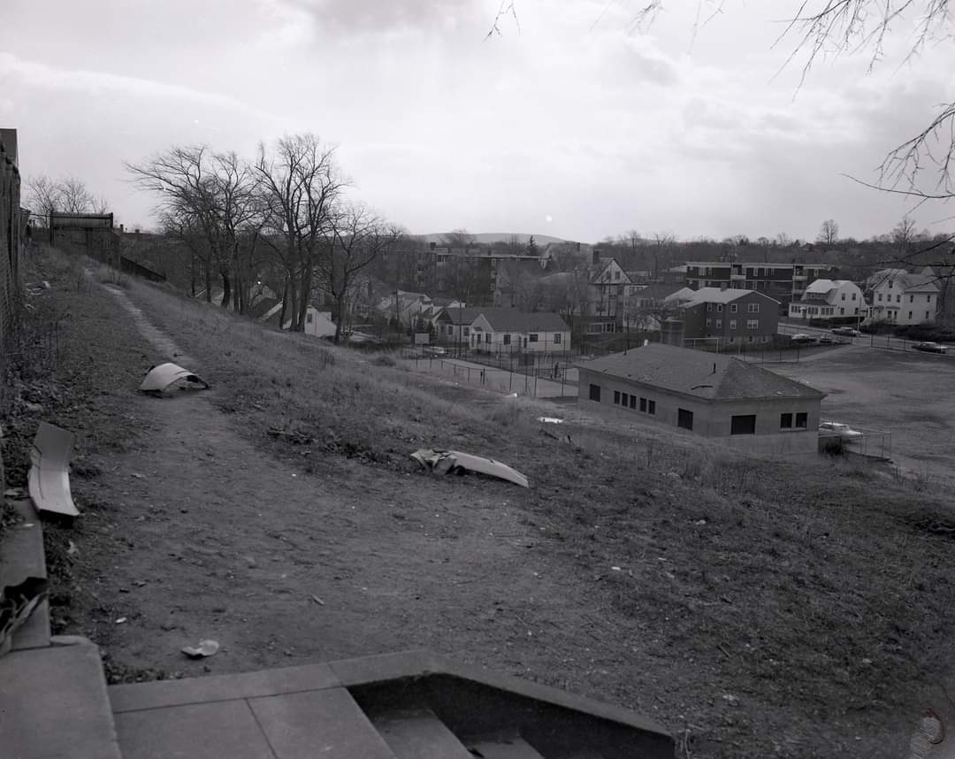 Vintage B&amp;W photo from top of the hill looking down at Hemenway Park and its multi-purpose field for football, baseball, and, in winter, flooded and frozen for hockey. Bball court next to aulde bathhouse. <a href="/DorchesterOld/">Dorchester Archives</a>  #dorchester