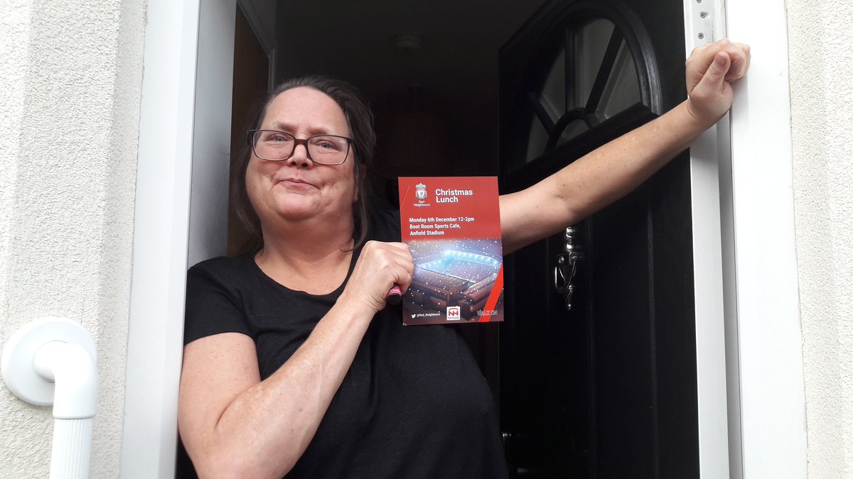 YHG resident and <a href="/AlleyAngels/">Alley Angels</a> volunteer is deighted to receive her ticket for the <a href="/Red_Neighbours/">Red Neighbours</a> Christmas Lunch