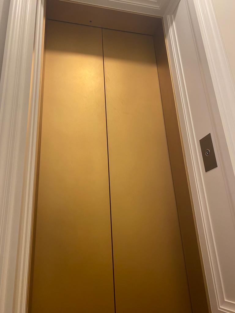 Lift opening at a private residence.  Rose gold one of our many bespoke patinations.