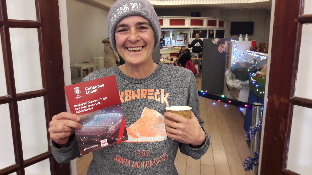 YHG Customer, Alley Angel &amp; Liverpool Lighthouse Volunteer is delighted to receive her ticket to the <a href="/Red_Neighbours/">Red Neighbours</a> Christmas Lunch as recognition of all her hard work during 2021 in Anfield.