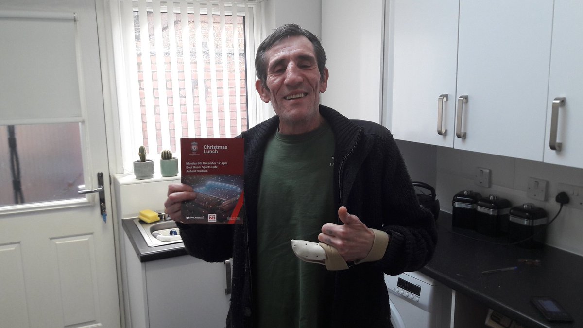 Another happy YHG resident and <a href="/AlleyAngels/">Alley Angels</a> volunteer who is happy to receive his ticket for the <a href="/Red_Neighbours/">Red Neighbours</a> LFC Christmas Lunch!