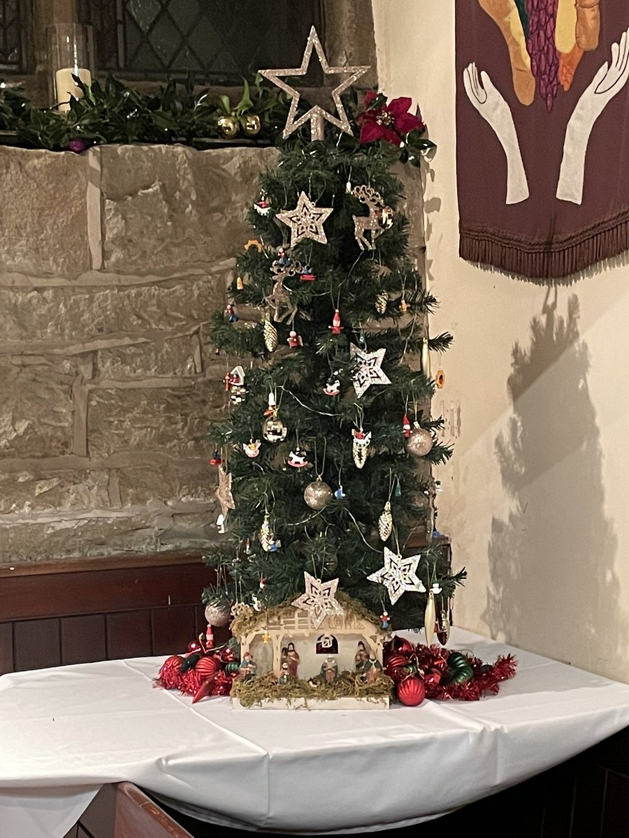 Friends of Conduit street’s entry. We have filled the tree with little wooden children playing.