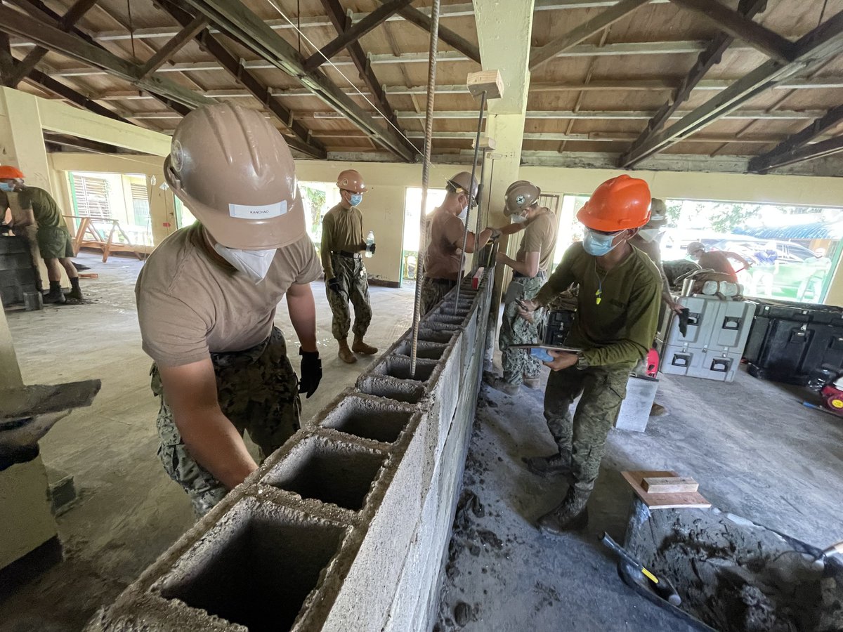 USNavy's tweet photo. Building on more than just #NavyPartnerships ⚒️
#Seabees assigned to #NMCB5 & members of @TeamAFP's 565th Construction Engineering Battalion work on various construction projects throughout the Indo-Pacfic region during #PacificPartnership21. https://t.co/4u4QbmcUUE