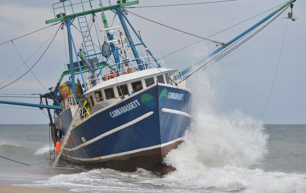 Waves crash against the Carrabassett fishing trawler as the tide goes out at Longnook Beach in Truro. The New Bedford based boat was grounded earlier this week. <a href="/capecodtimes/">Cape Cod Times</a>