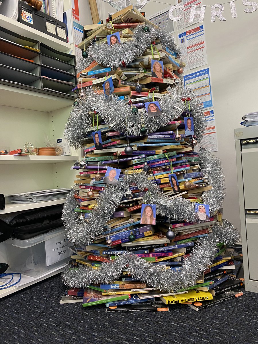 SJBHS3's tweet photo. Our English faculty have Built a Literacy Tree, one book at a time. So amazing!! We love this time of year! Merry Christmas! @mkitteringham @NSWEducation https://t.co/csEbwu0KX0