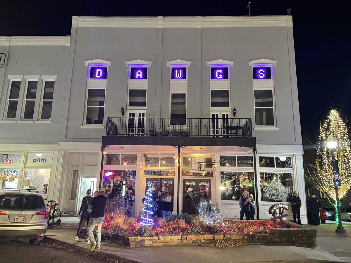 EBSorensen's tweet photo. Tim’s on the square is rooting for the Fayetteville Purple Dogs. https://t.co/7QXN7YmmxX