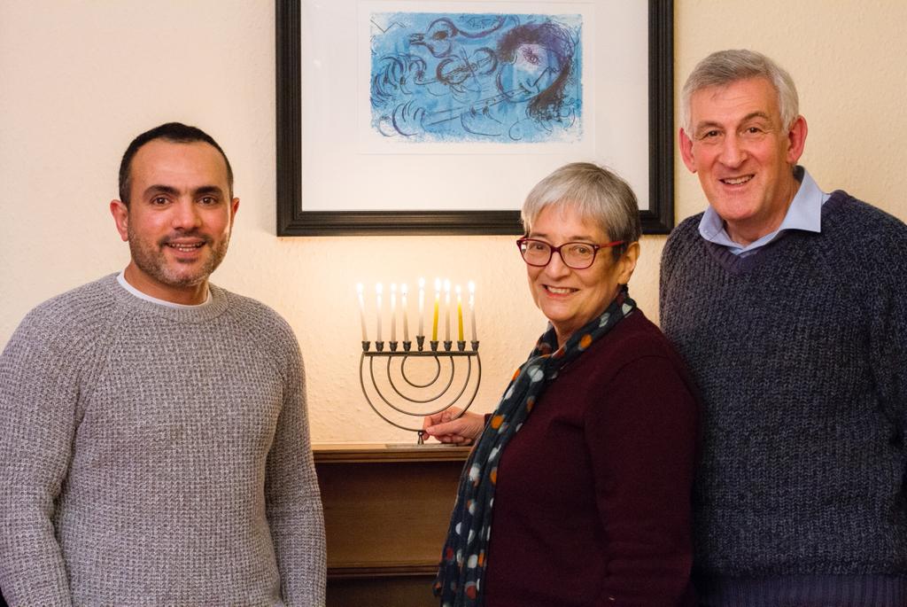 RefugeesAtHome's tweet photo. On this #goodnewsfriday we want to wish a #HappyHanukkah2021 to everyone celebrating. This picture from last year was part of our #LockdownLights series - Are you hosting now? Please send us your seasonal pix with your #guests so we can share the light. (With their consent ovvie) https://t.co/TExidCxxMt
