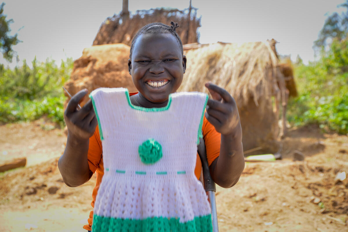 WorldVision's tweet photo. “I was trained with skills in knitting and I have been making children clothes that I sell.”

Betty is a South Sudanese refugee living in #Uganda. She’s one of 10,000 people with disabilities we're supporting with @Ulkoministerio's help: https://t.co/W1xkE6yY50

#FridayFeeling https://t.co/b3xS0Lnu4s
