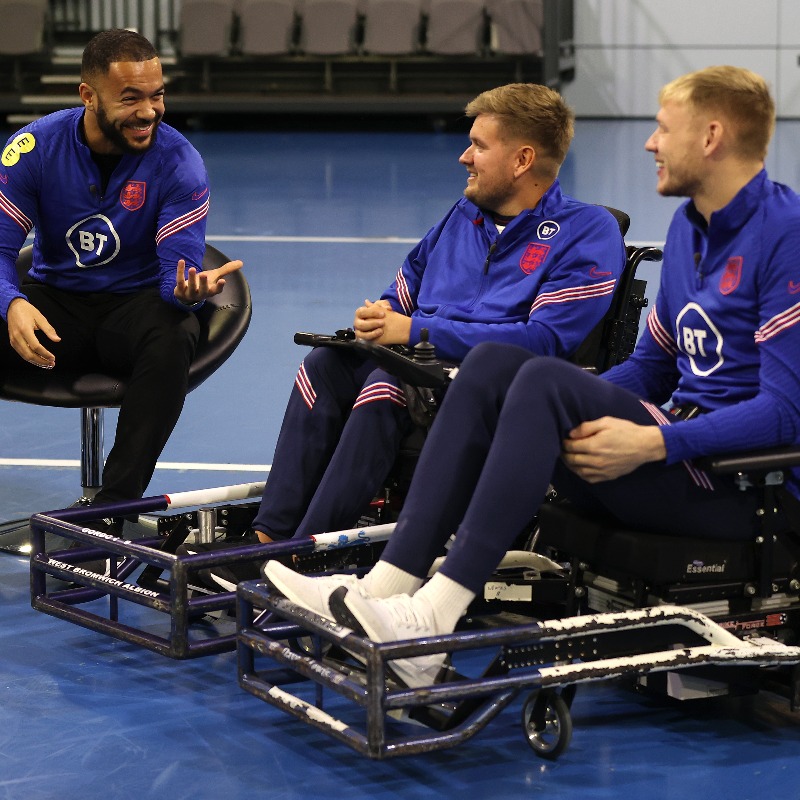 England's tweet photo. Here's what happened when @jbolding8 and @CGordon_90 from our Para Lions were joined by @AaronRamsdale98 and @BenChilwell to introduce Powerchair football to a new audience 👊