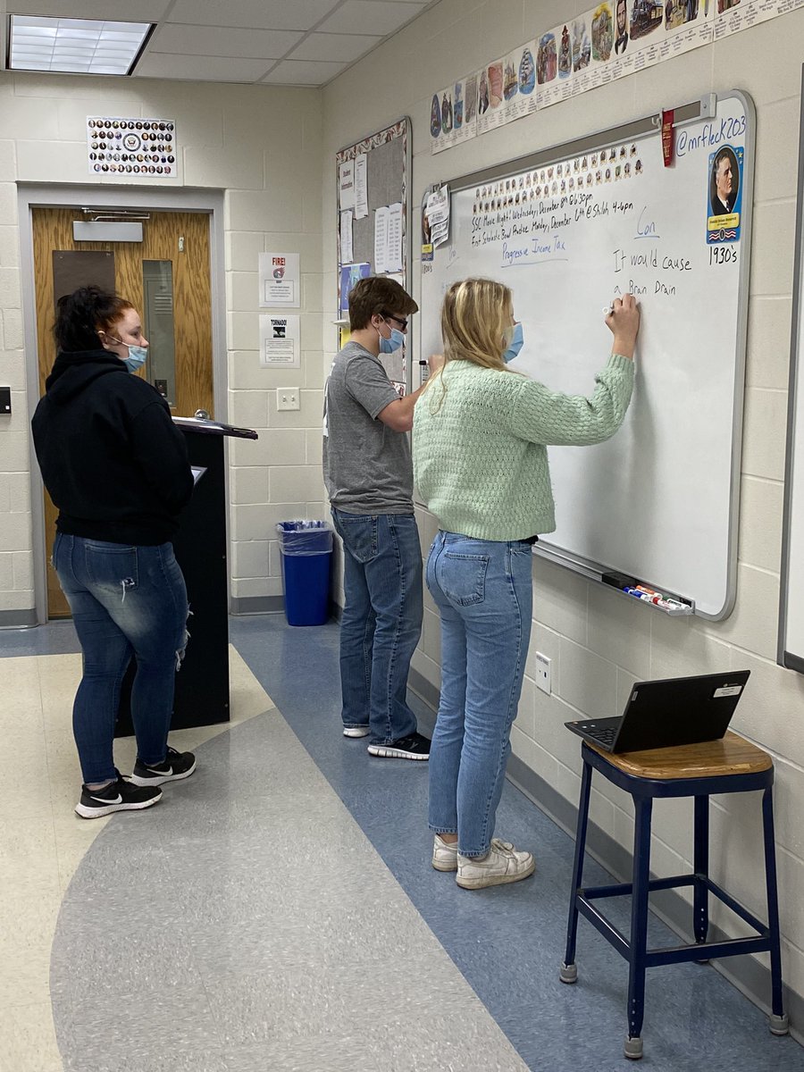 mrfleck203's tweet photo. Civics students research current political topics and are required to find the arguments both sides make. Students share their findings on the board and hold a class discussion on their findings. Here students are sharing their findings on the progressive income tax. #TitanTrue https://t.co/rT9Dku71SJ