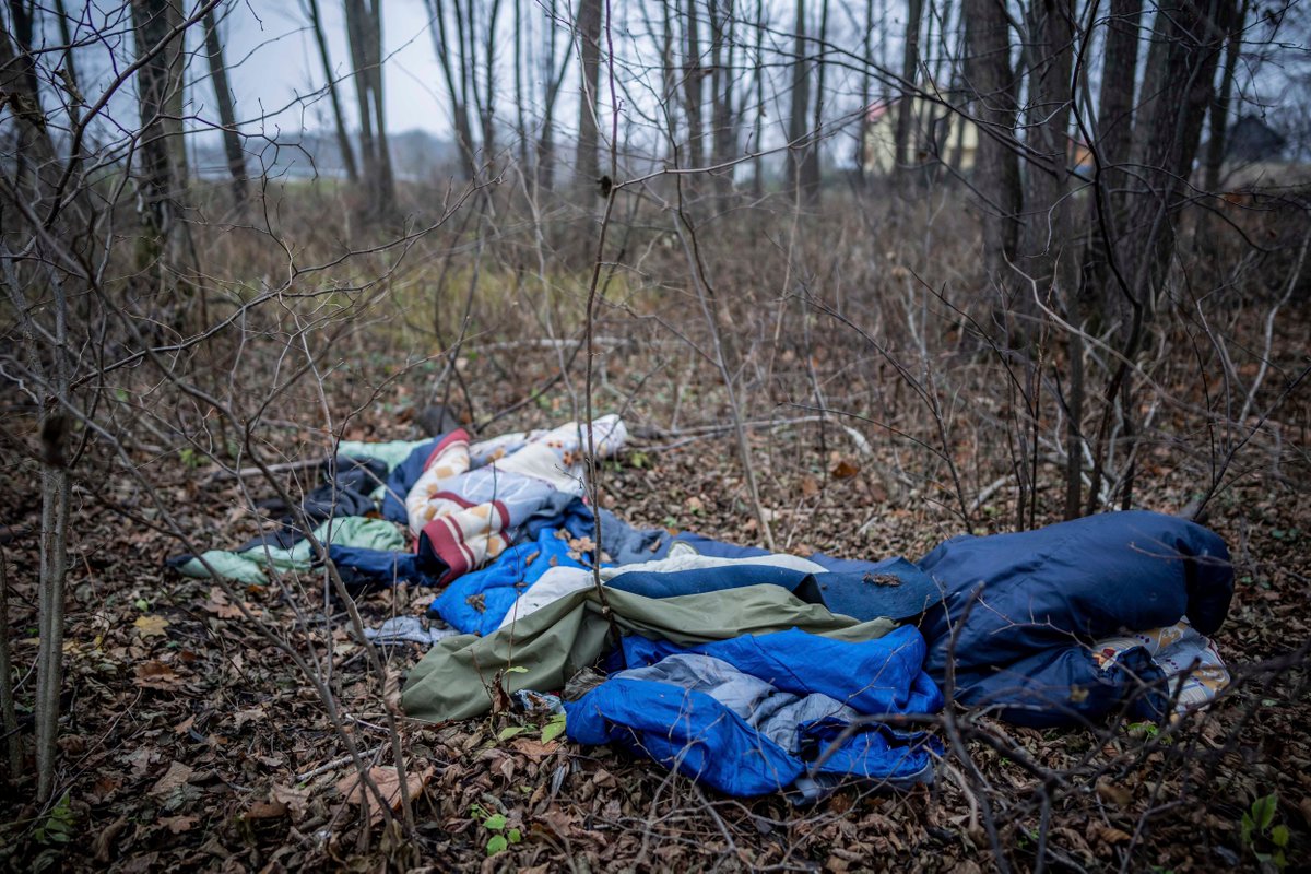 Blankets and sleeping bags lie abandoned in the forest on the border between Poland and Belarus, November 11, 2021.