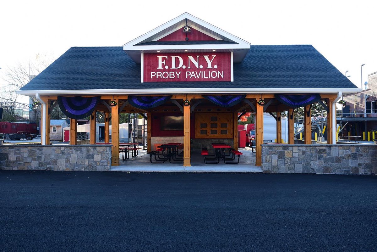 FDNY's tweet photo. FDNY Firefighters drape purple and black bunting on the exterior of the FDNY Fire Academy on Randall’s Island where Probationary Firefighter Vincent Malveaux was assigned. Read more: https://t.co/ZjL3P2jMYm https://t.co/pHJXC5QHEa