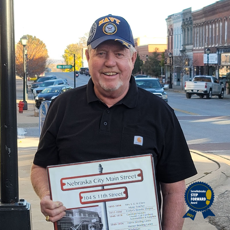 ServeNE's tweet photo. The Veteran Volunteer Awardee at the 2021 #StepForwardAwards is U.S. Navy Vet. Jim Kuhn! Jim has been instrumental in preserving historical buildings and public spaces in @Nebraska_City. Help us thank him at the Step Forward Awards next Thursday! https://t.co/2Ir2n9m0Cn https://t.co/PkquUljyHM