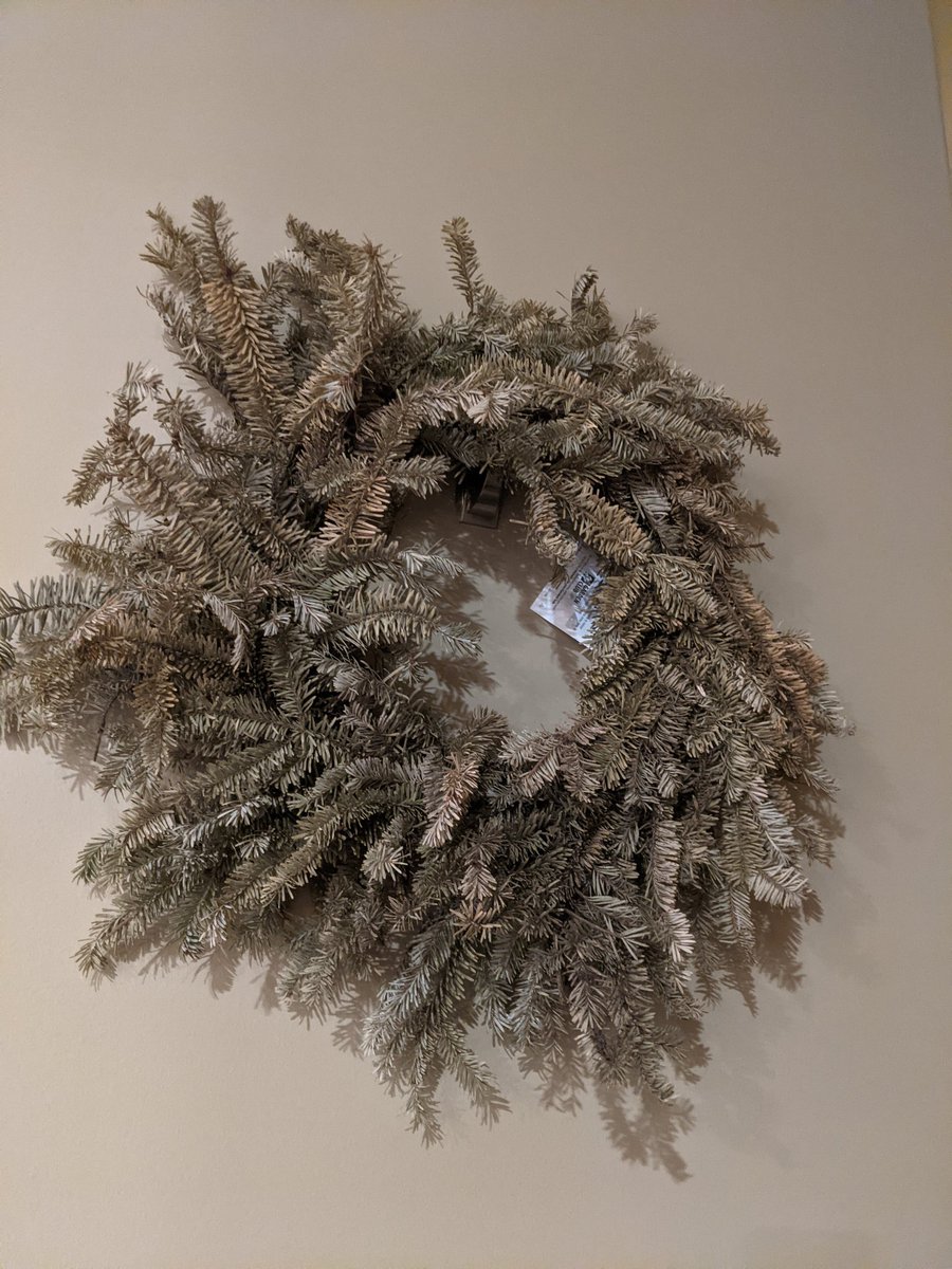 Palila's tweet photo. We still have the wreath from last year up, the one we got "for the smell". Didn't even take the tag off. #divulgeDecember https://t.co/BweFtjkHGU