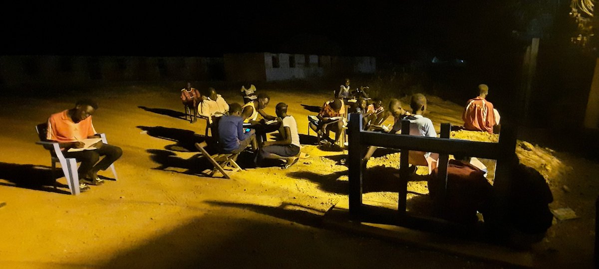 JalalWFP's tweet photo. Outside @WFP_SouthSudan guest house in Kuajok, school children studying to prepare for exams. Our guest house is one of very few places with light at night  and they sit outside to study. Bravo to the kids for their amazing passion!!!! https://t.co/w8mEay9mHn