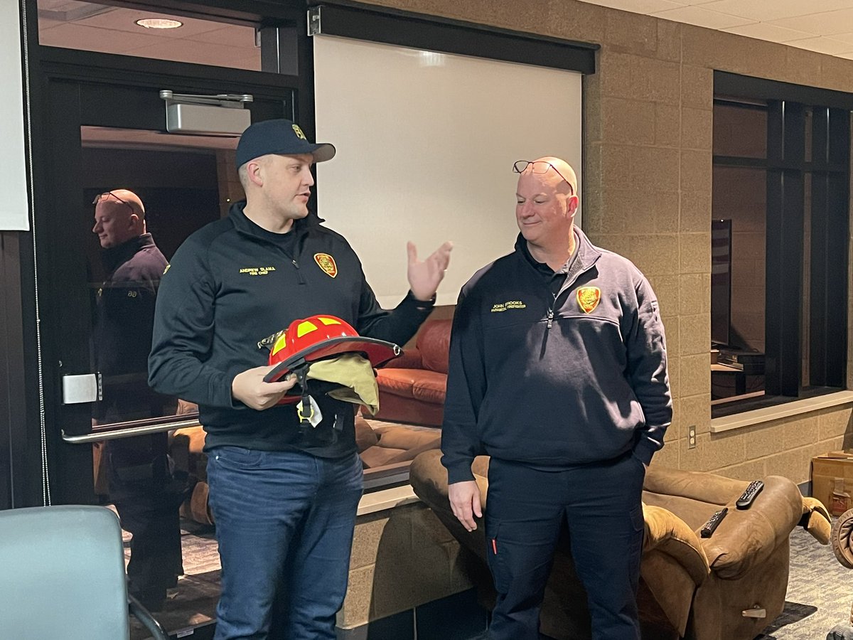 EdinaFire's tweet photo. Edina Fire Chief Slama presenting Captain John Brooks with his helmet this morning. Captain Brooks was recently promoted from Firefighter/Paramedic to Captain and begins his new role today at 0700. Congrats Captain Brooks! 🚒🚨🚑 https://t.co/5sfpoF2me5