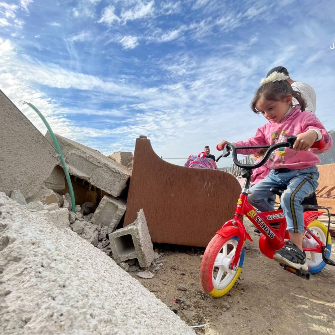 MemoHamada16's tweet photo. Over the rubble of their house.. and their shattered dreams and memories that were flattened by the occupation authorities.. the children of Moath al-Rajabi play innocently, unaware of the fact that they have become homeless.#Act4Palestine https://t.co/I1Y5XSP01v