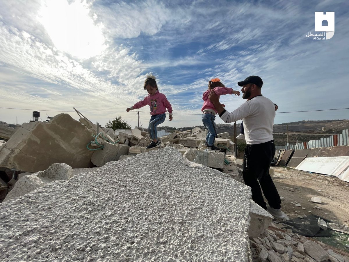 MemoHamada16's tweet photo. Over the rubble of their house.. and their shattered dreams and memories that were flattened by the occupation authorities.. the children of Moath al-Rajabi play innocently, unaware of the fact that they have become homeless.#Act4Palestine https://t.co/I1Y5XSP01v