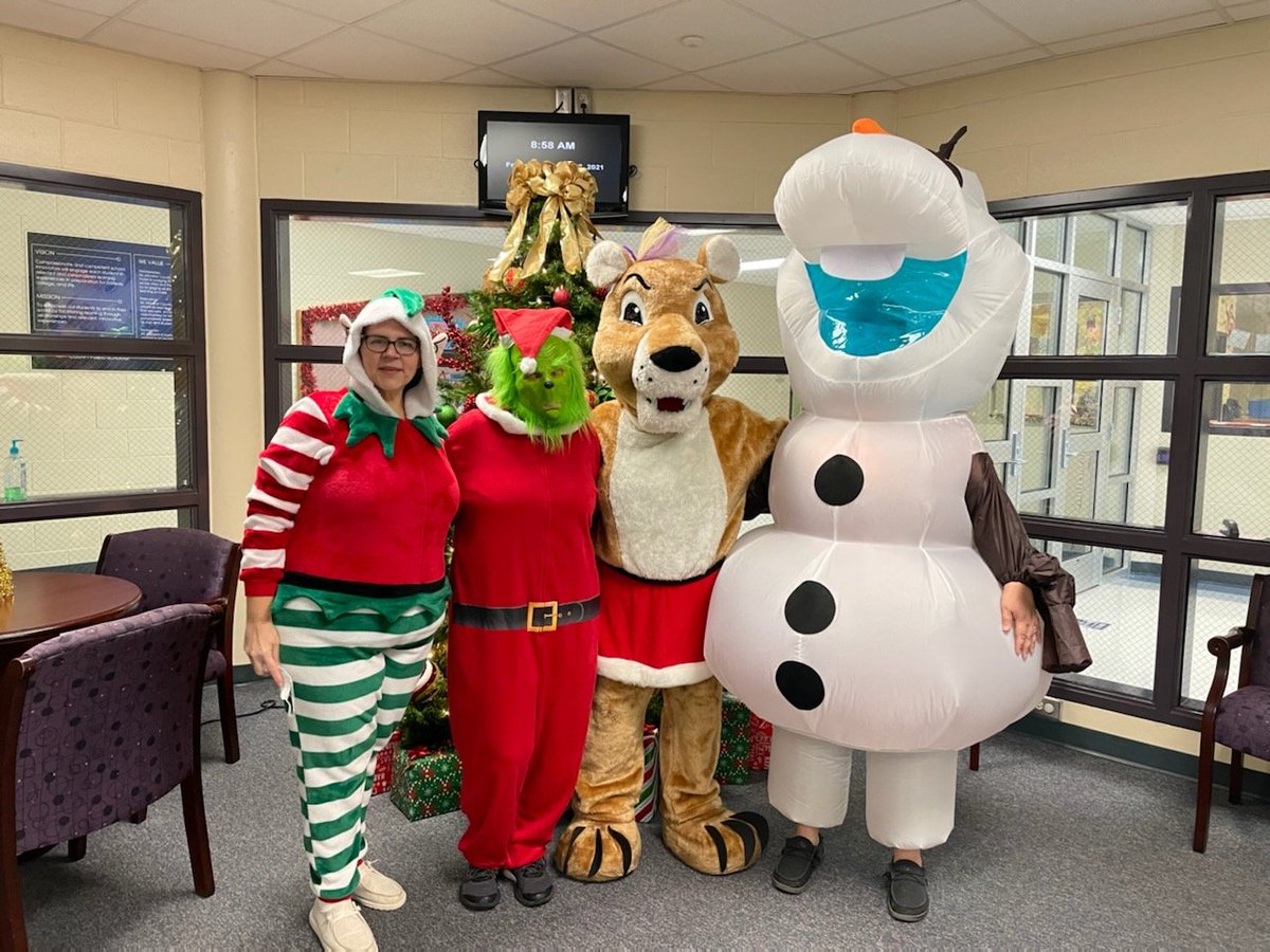 This crew was at morning carpool bringing Christmas smiles to kids and parents!