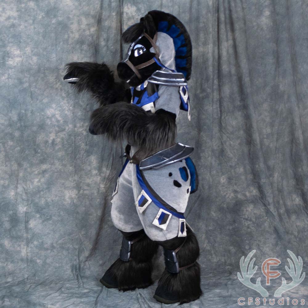 P0Eproductions's tweet photo. Meet the NOBLE STEED! 🛡️ She's an artistic liberty "knight's horse", 100% designed by us! ⚔️ She features some lovely hand sewn spots, custom tack, plus armor &amp; a shield made of our Armor Foam. We are SO proud of this suit and hope she gets a lot of love! 🖤💙🖤💙#FursuitFriday https://t.co/LpK2Xr1me3