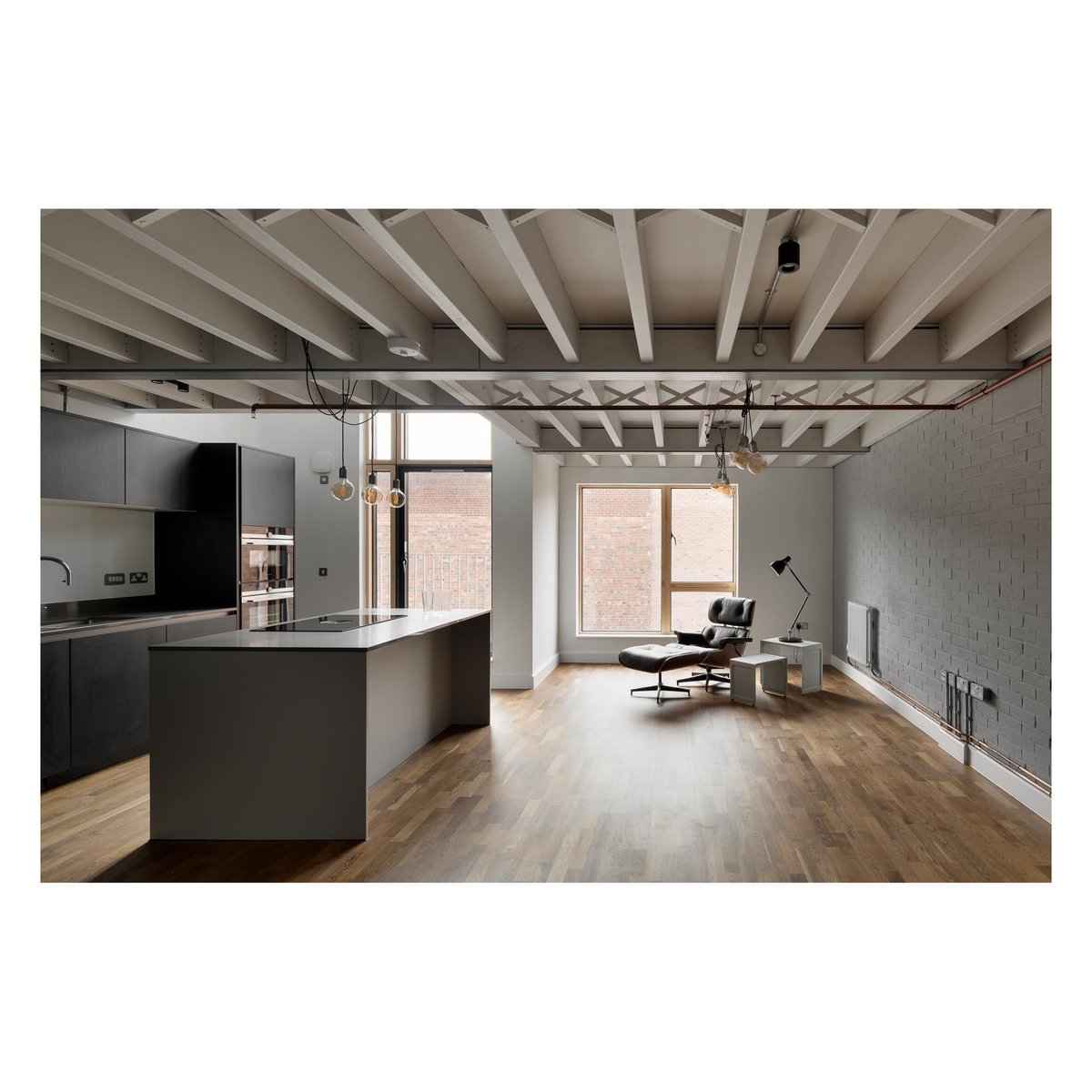 1-2 Legge Lane. Houses 2A-2G have a kitchen and dining area which is part of a cube of living space. A two storey window brings light deep into the house and leads to the breakfast terrace. The expressed timber ceiling structure creates a cozy atmosphere. <a href="/maguirejackson/">Maguire Jackson</a> <a href="/MyJQ/">My Jewellery Quarter</a>