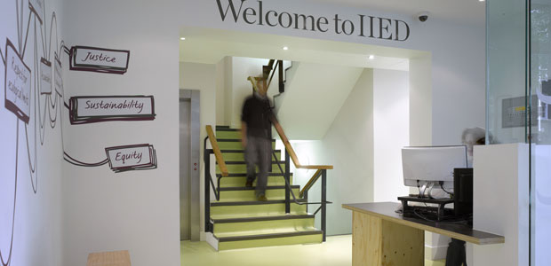 A person walking down some stairs with the words 'Welcome to IIED' above their head.