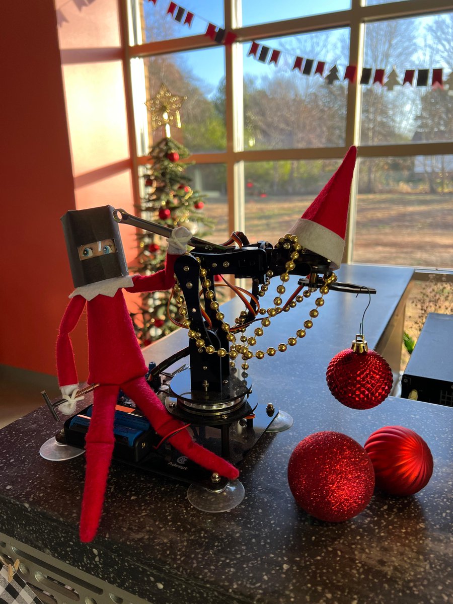 UACCB's tweet photo. Buddy and Judy visited the Workforce Training Center and Row John's Library today! Buddy learned about machine operation and safety. Judy found a cozy spot in the Row Johns Library to pick a book. #UACCBElves https://t.co/CCSi0ID0Mc