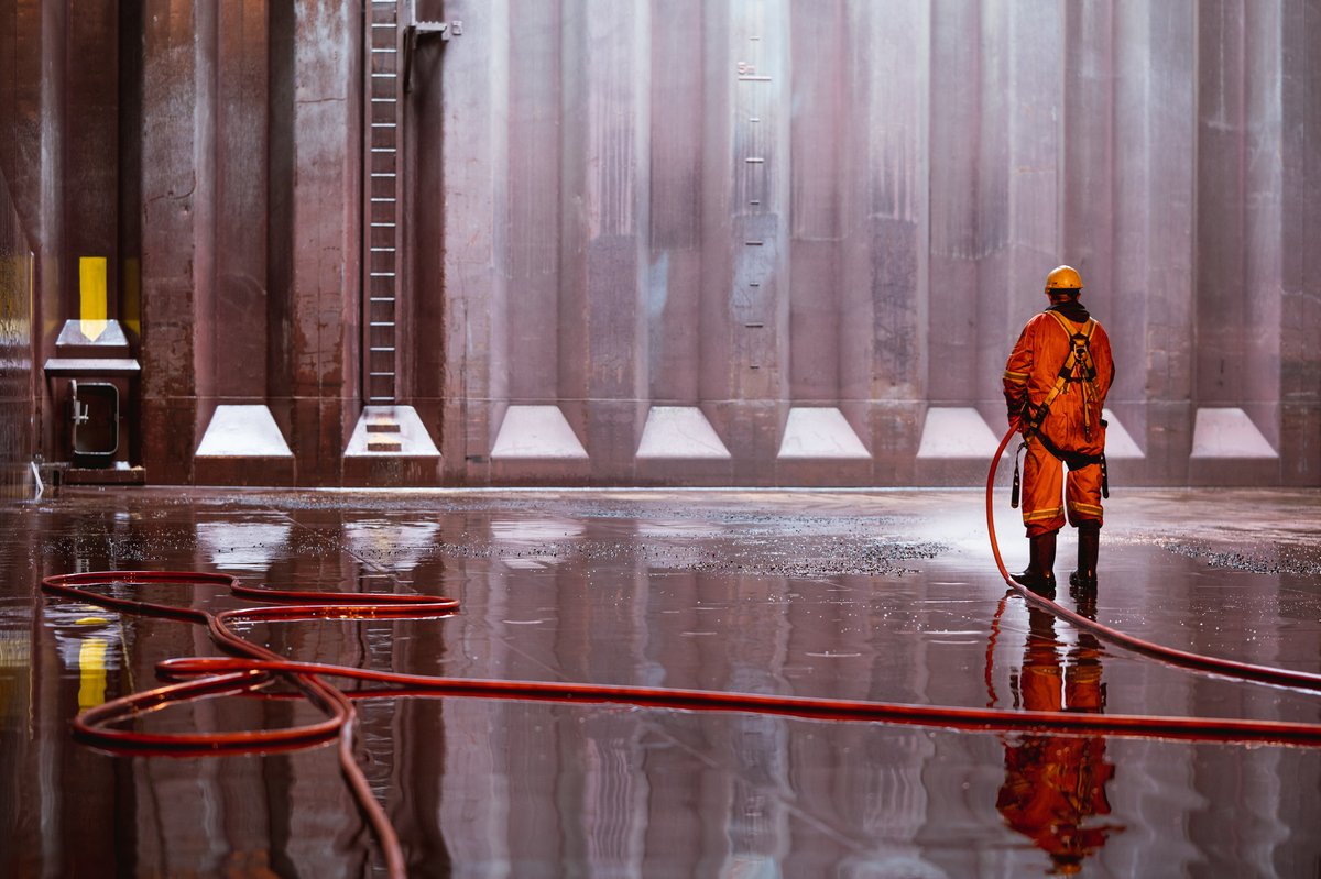 Ever wonder how we clean our approx. 320,000 ft3 cargo holds? Well for starters you need a really long hose and some rubber boots. Here O/S Randy is washing down one of five holds to prepare for the next cargo to be loaded #cargo #crew #sailorlife 📸<a href="/mikeblack_photo/">Mike Black PhotoWorks</a>