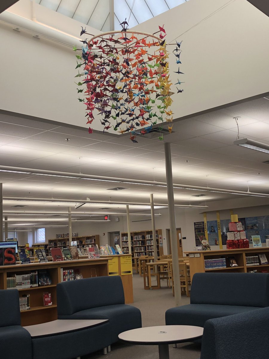 LewisHSLibrary's tweet photo. Ending this year on a high note! We installed our origami crane chandelier this morning. Cranes were made by Lewis students during our first Service Friday. Together we can make a difference! @findreadexplore @JohnLewisHSFCPS @FCPSR3 @FCPS_LIS @fcpsnews https://t.co/XtyiPyVtum