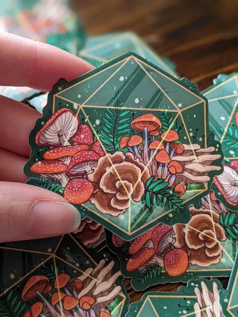 D20 mushroom terrarium stickers are back in stock! Their color is slightly more saturated this batch from the printer but otherwise!