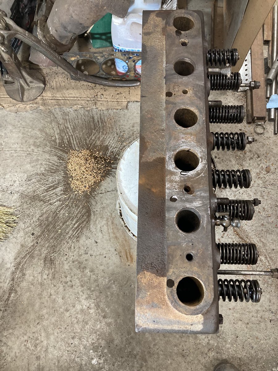 bpsattler's tweet photo. I thought I was rich when the plump, high priced RSW in this picture started flowing out of the intake ports of the head of Grampa’s antique tractor I’m restoring and….then I found a crack in the head. Going to take more than the RSW to fix this problem :-) https://t.co/9XybWYyKBe