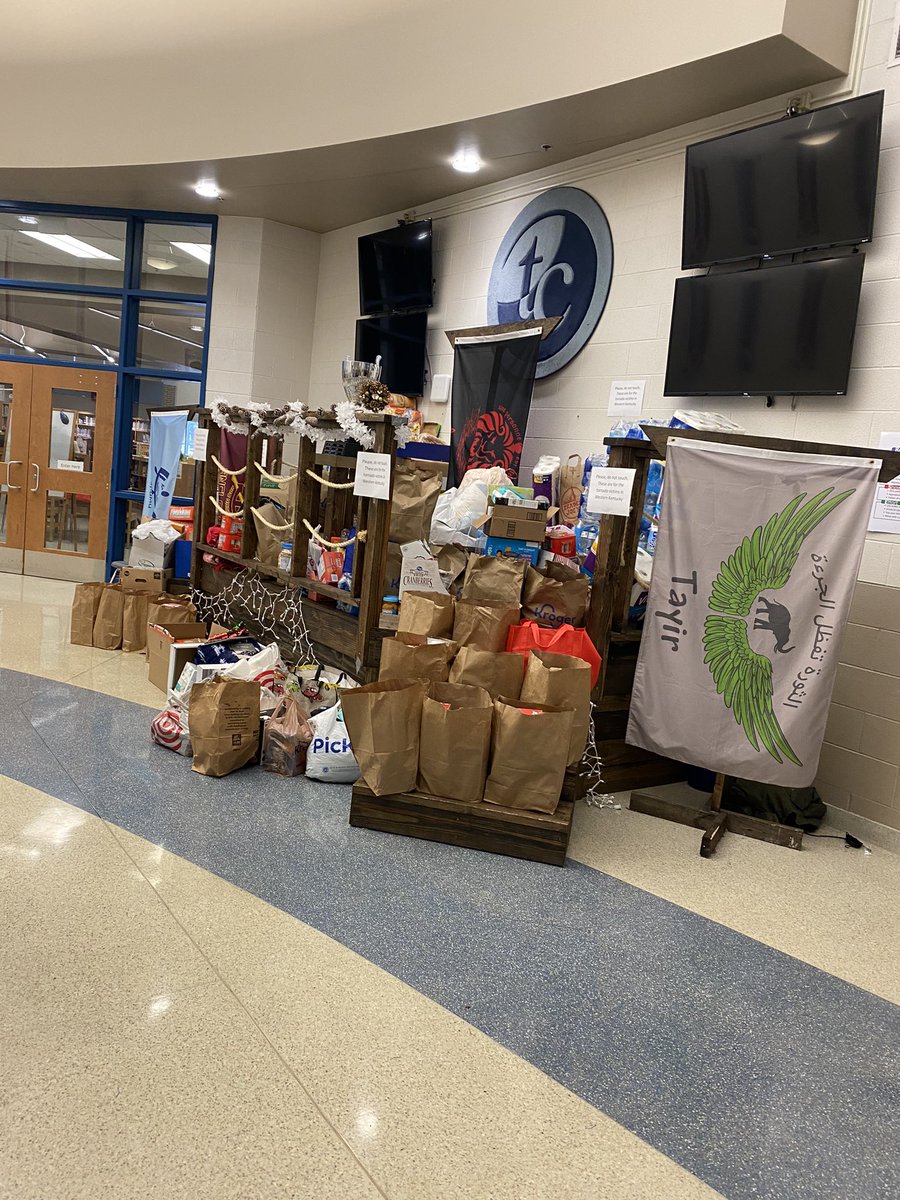 BoyB00ts_eth's tweet photo. Food bags, holiday assistance, and a huge donation pile for those in Western KY. Proud of our support staff, teachers, families and students. #IBelongHere https://t.co/a0WTqfENds