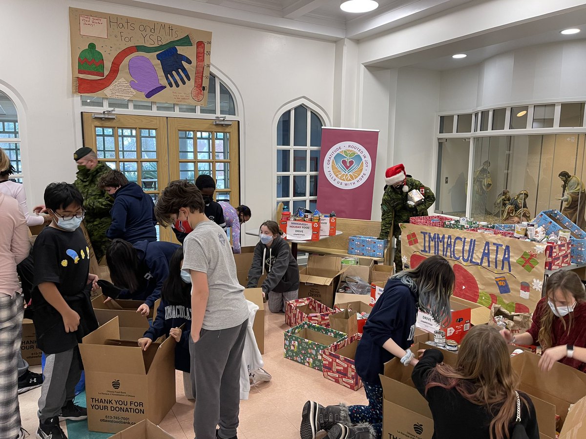 lemjen22's tweet photo. Had to call in military back up for this one!! What a food drive @ImmaculataOCSB ! Incredibly generous students and staff this holiday season helping our community 💙💙 #WhyMac @OttawaFoodBank @aaronfalsetto https://t.co/zy2zPwPOTx