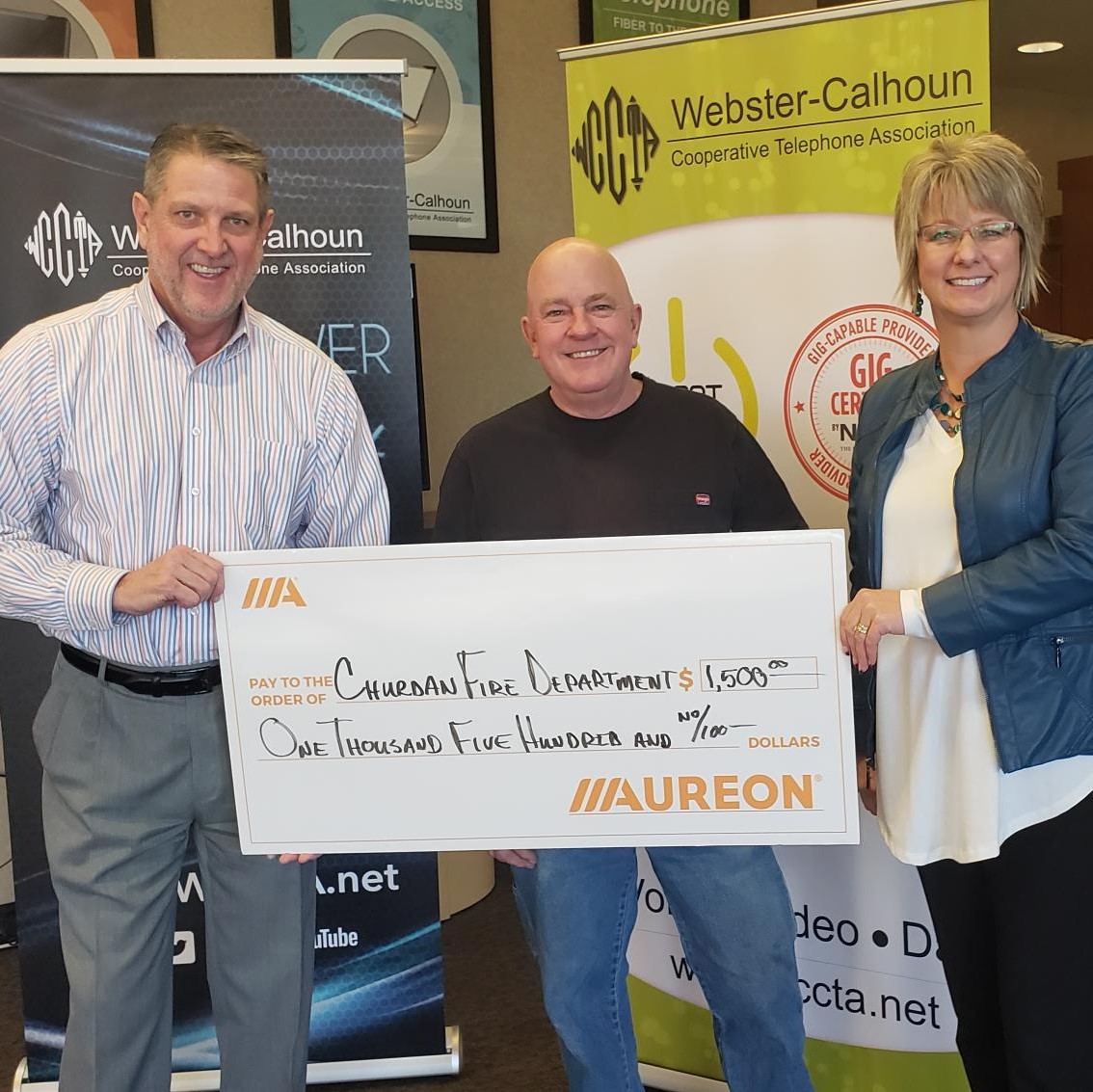 WebsterCalhoun's tweet image. The community of Churdan received several Aureon Charity Grants  Kent Atha from Aureon, and Marcie Boerner from WCCTA, present the checks to Anthony Minnehan of Churdan.