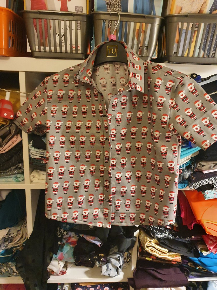 MissSpencerDT's tweet photo. On the last day of my #CovidIsolation, I did a bit of #SaturdaySewing - one fabulous santa shirt for the big nephew, just waiting for buttons, and a super bright pair of dungarees cut for the small nephew ready to sew tomorrow https://t.co/5NCa7EeEyt
