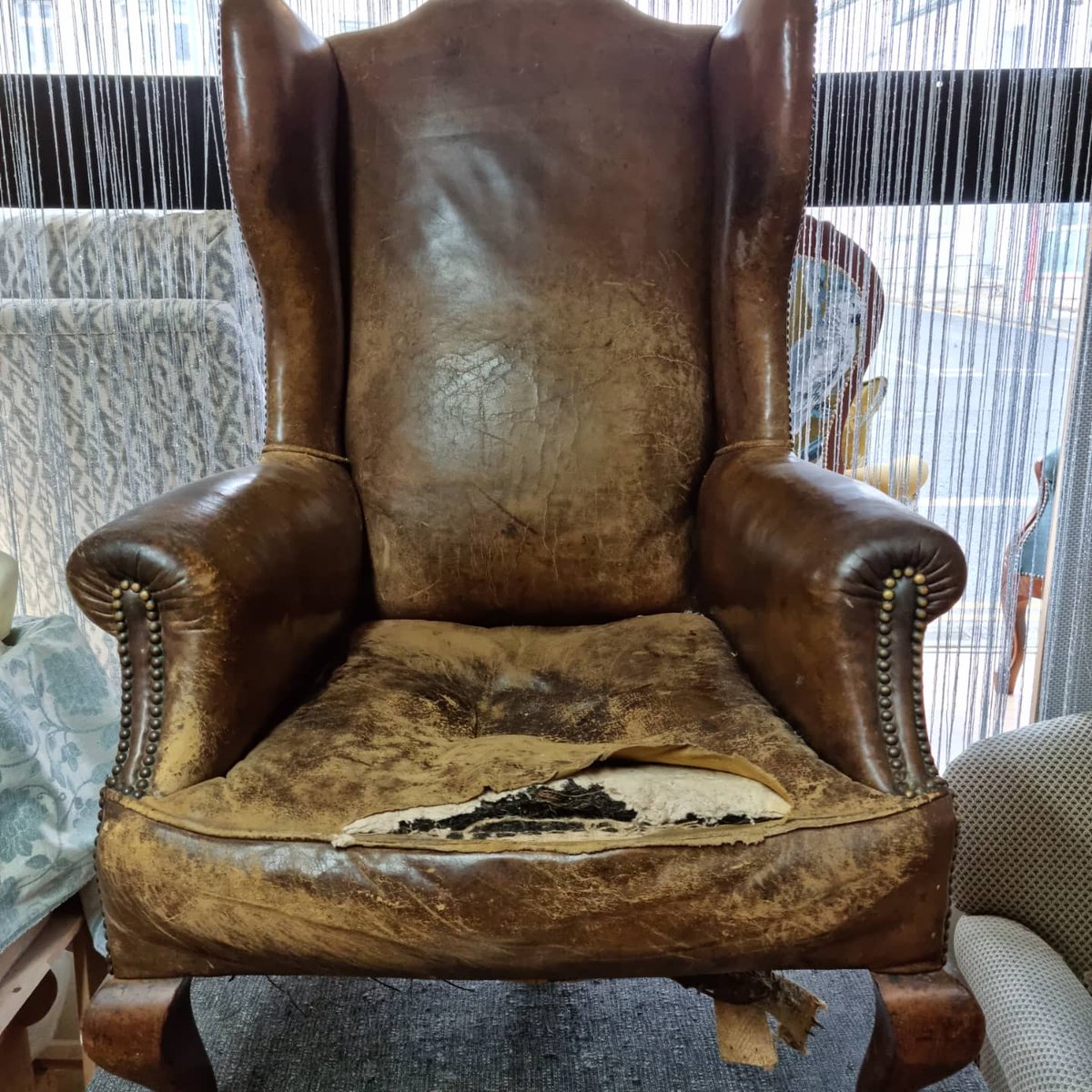 Before and after chair reupholstered in Leather