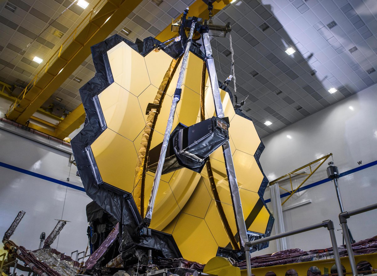 The primary mirror of the James Webb Space Telescope resembles a golden honoeycomb, composed of 18 gold-plated hexagonal segments.