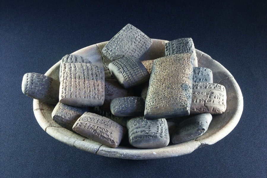 Cuneiform terracotta tablets, ca. 1400 BC, Qatna, Syria. 63 cuneiform tablets were discovered in 2002, in a subterranean corridor. They were covered by the burned remains of several roofbeams. Maybe they were hidden during the Hittite invasion.